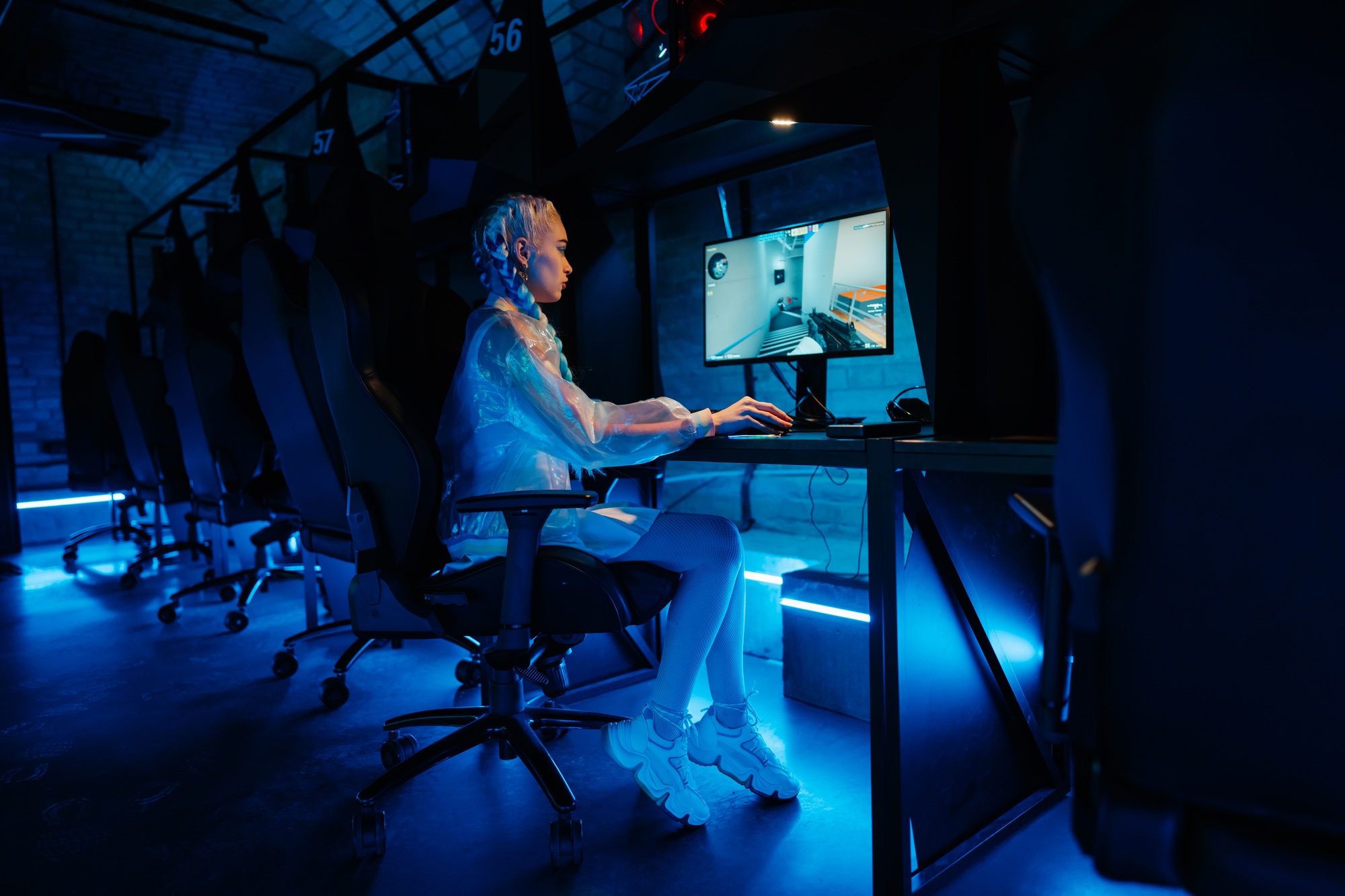 Young female cyber gamer, cosplayer plays computer games.